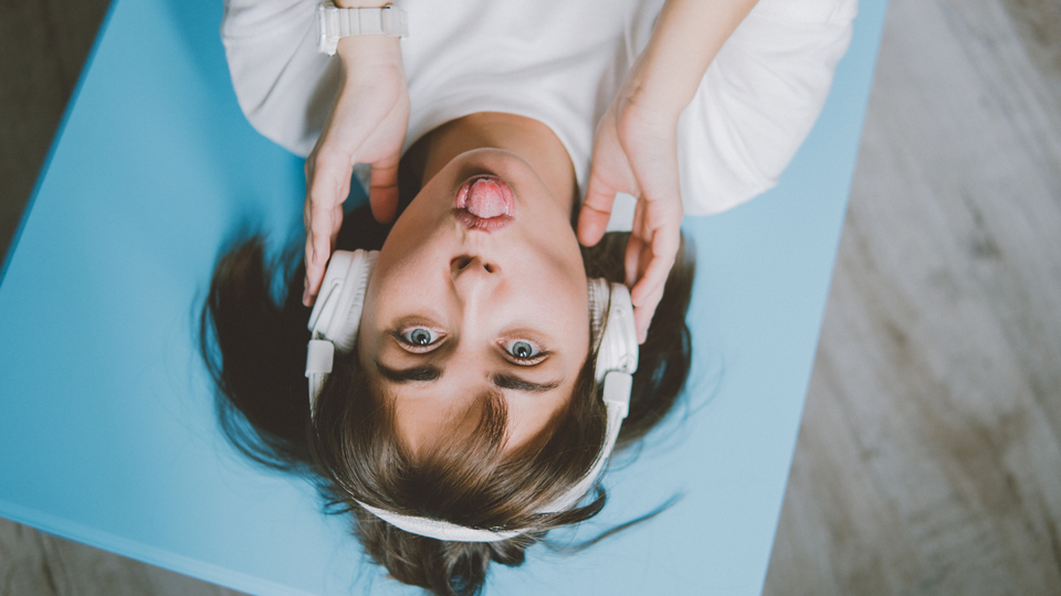 female listening with headphones