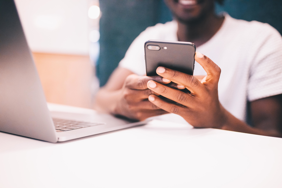 man reading blogs on his phone