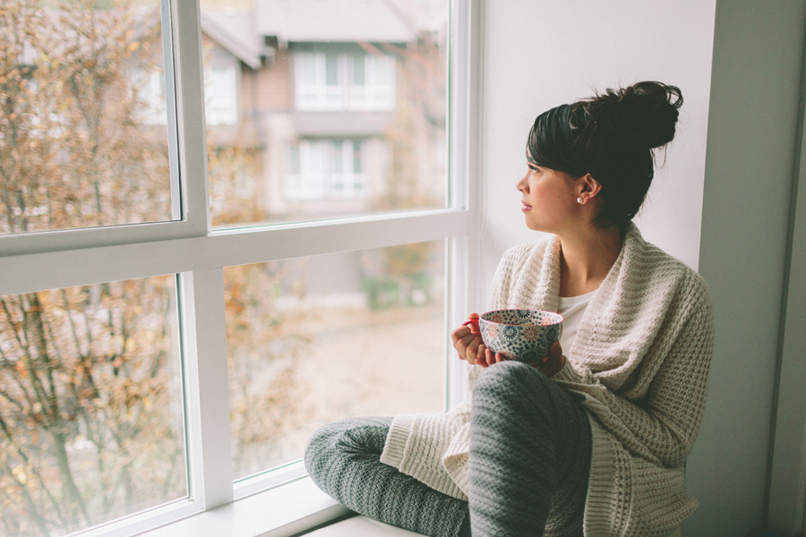 young-woman-sitting-window