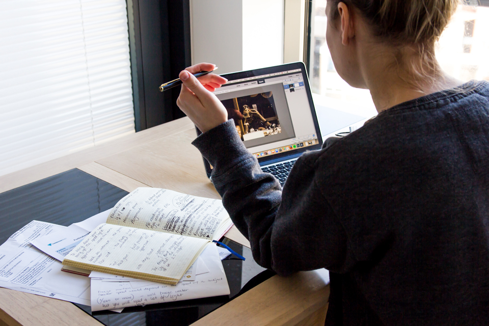 woman with laptop and books learning