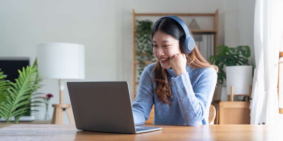 a woman listening to language-learning podcasts